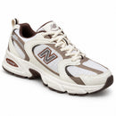 New Balance 530 Off/Café — vista frontal em três quartos, ponta à direita