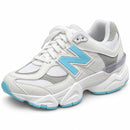 New Balance 9060 Branco/Azul BB — vista frontal oblíqua da outra face externa