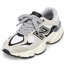 New Balance 9060 Cinza/Branco — frontal em três quartos, ponta para a esquerda