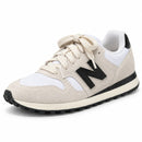 New Balance 574 Off/Preto — vista frontal oblíqua da outra face externa
