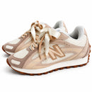 New Balance 204 L Off/Marrom — par em três quartos