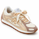 New Balance 204 L Off/Marrom — vista frontal em três quartos, ponta à direita