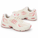 New Balance 530 Off/Rose — par em orientações opostas