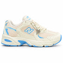 New Balance 530 Off/Azul — vista lateral