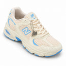 New Balance 530 Off/Azul — vista frontal em três quartos, ponta à direita