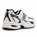 New Balance 530 Branco/Preto — traseira em três quartos