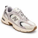 New Balance 530 Off/Lilás — vista frontal em três quartos, ponta à direita