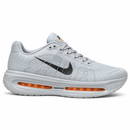 Nike Vomero Cinza/Laranja — perfil lateral externo